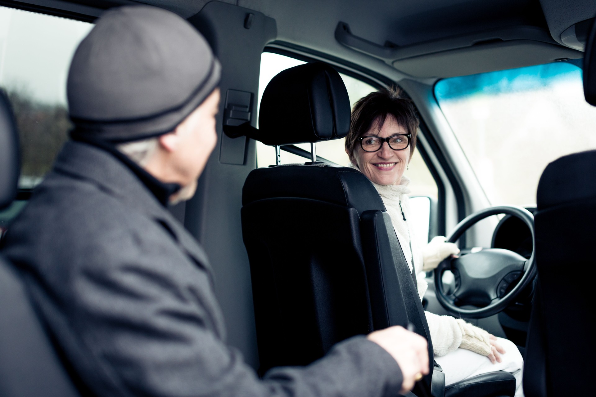 senior man sitting in paratransit van